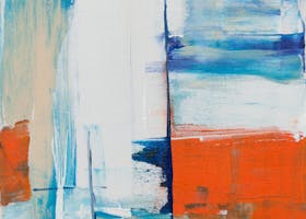 Dynamic abstract painting featuring bold colors and textures on canvas.